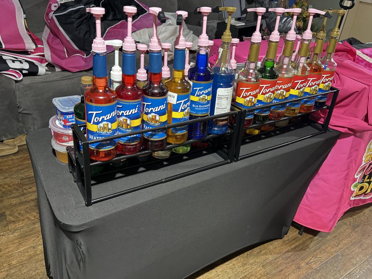Twisted Lemon Drop event table with lemonade flavor bottles and pink pumps